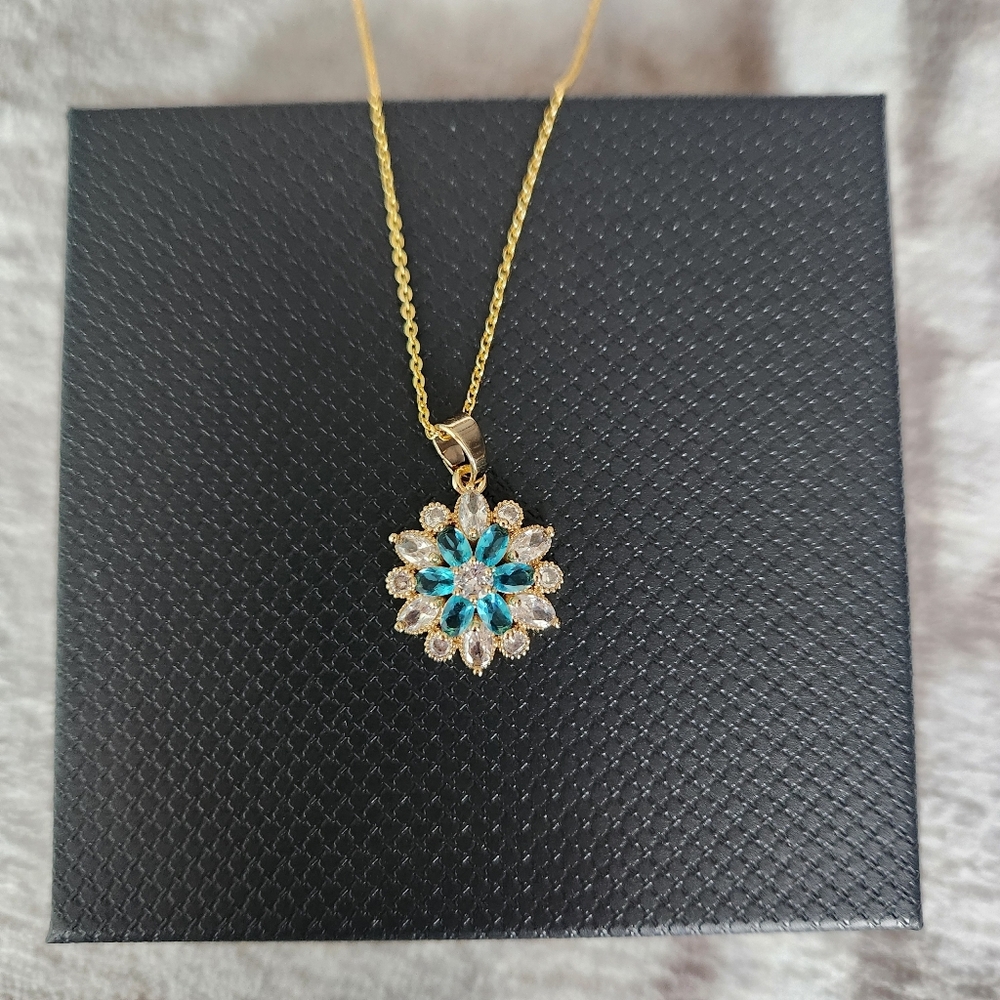 Gold Toned Adjustable Length Floral Pendant Necklace with Blue and Clear Stones